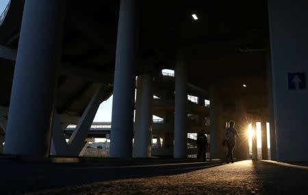 FILE PHOTO: A woman walks through Mordovia Arena in Saransk, Russia June 27, 2018. REUTERS/Ricardo Moraes/File Photo