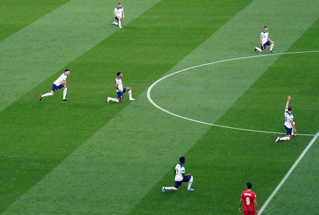 England players take a knee ahead of the 2022 World Cup fixture against Iran