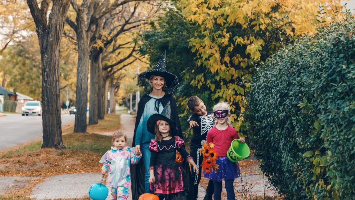 trick or treat mother with children going to trick or treat on halloween holiday