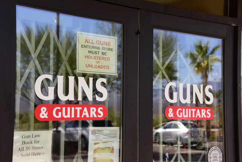 <p>The entrance to Guns & Guitars store is seen in Mesquite, Nev., Oct. 3, 2017. Stephen Paddock, who had purchased fire arms at Guns & Guitars, killed dozens and injured hundreds when he opened fire on a country music concert in Las Vegas, Nevada, Oct. 1, 2017. (Photo: Robyn Beck/AFP/Getty Images) </p>