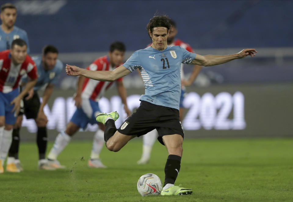 Uruguay's Edinson Cavani scores from the penalty spot against Paraguay during a Copa America soccer match at Nilton Santos stadium in Rio de Janeiro, Brazil, Monday, June 28, 2021. (AP Photo/Silvia Izquierdo)