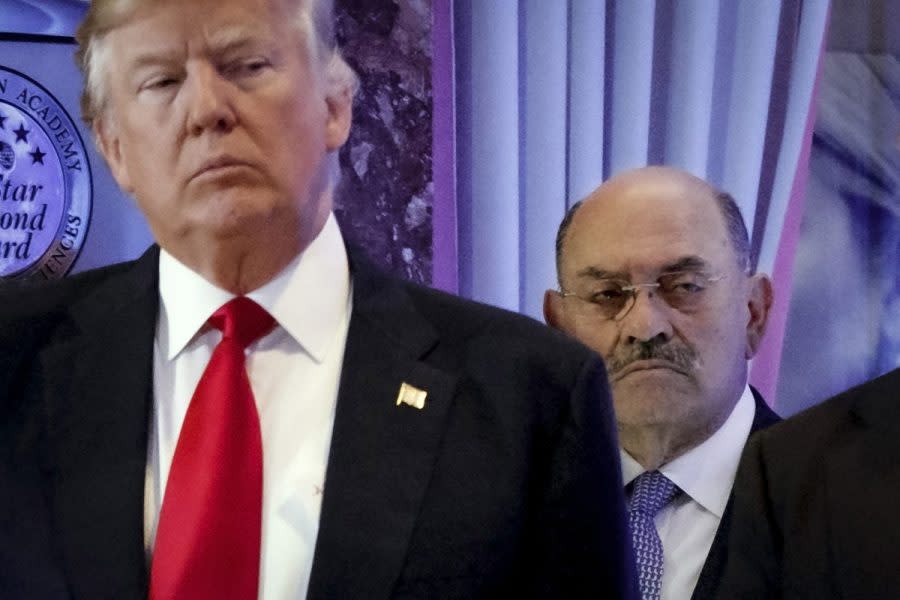 Allen Weisselberg, right, stands behind then President-elect Donald Trump during a news conference in the lobby of Trump Tower in New York, Jan. 11, 2017. Weisselberg, Trump's chief financial officer, is expected to plead guilty on Thursday, Aug. 18, 2022 to tax violations in a deal that would require him to testify about business practices at the former president's company. (AP Photo/Evan Vucci, File)