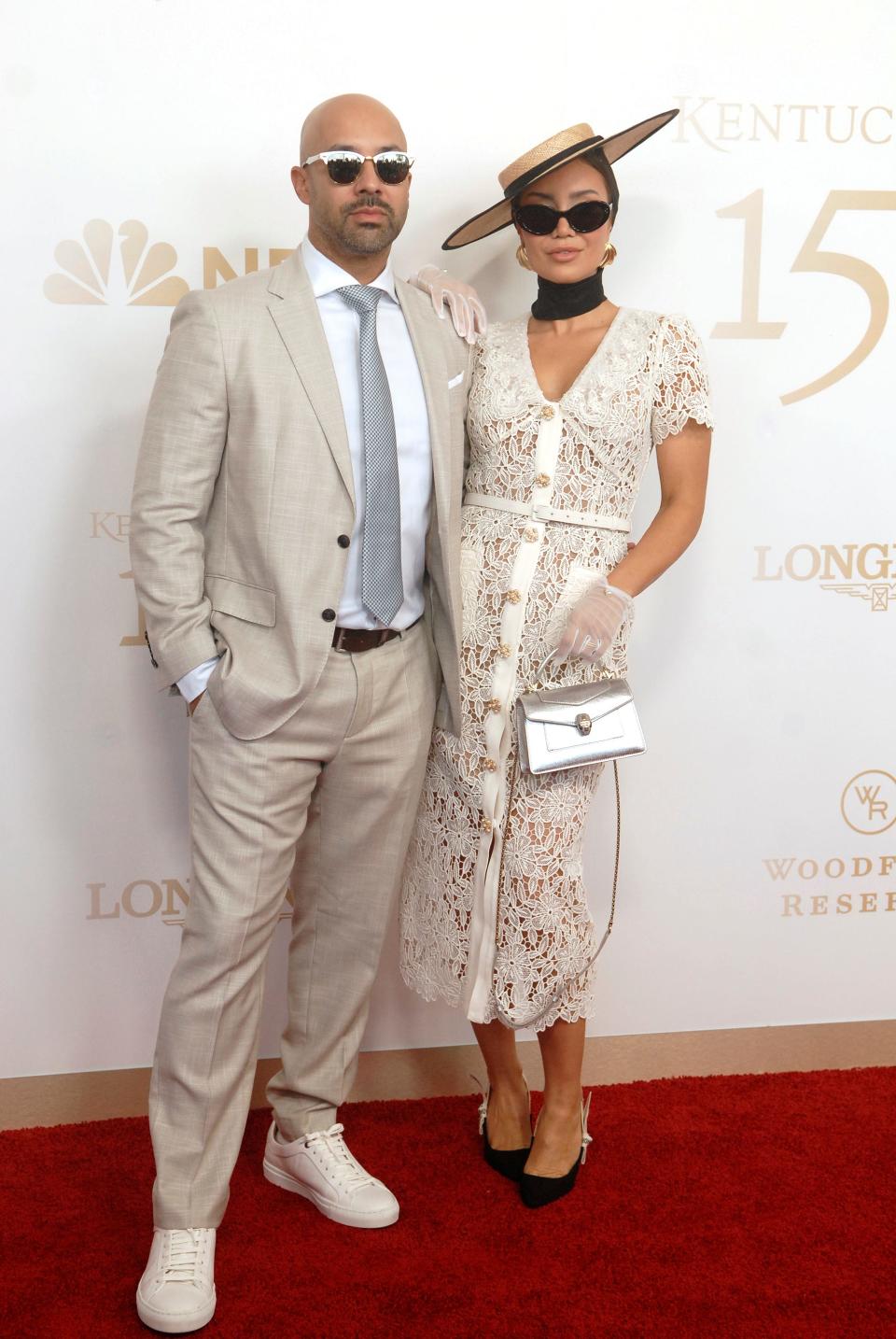 Influencers Kane Vato, left, and Pia Muehlenbeck, right, pose on the 150th Kentucky Derby red carpet Saturday. May 04, 2024