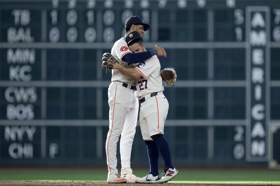 Houston Astros' Jose Altuve, right, and Jeremy Pena celebrate the team's win over the Arizona Diamondbacks in a baseball game, Saturday, Sept. 7, 2024, in Houston. (AP Photo/Eric Christian Smith)