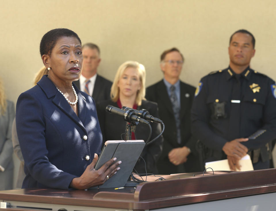 Contra Costa County District Attorney Diana Becton discusses the arrest of Roy Charles Waller, who is suspected of committing a series of rapes, during a news conference Friday, Sept. 21, 2018, in Sacramento, Calif. Waller, 58, was arrested on Thursday, Sept. 20, by Sacramento Police, and is suspected of committing at least 10 rapes across Northern California between 1991 and 2006. In the background is Sacramento County District Attorney Anne Marie Schubert, center, Sacramento Police Chief Daniel Hahn, right. (AP Photo/Rich Pedroncelli)