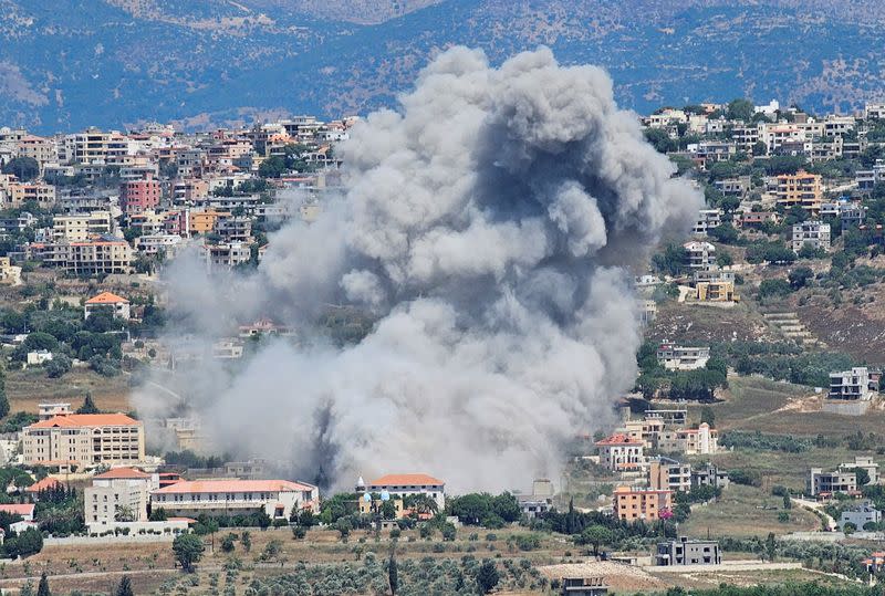 Smoke rises as pictured from the town of Qlayaa