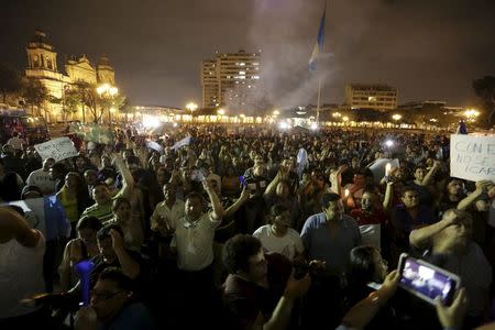 People celebrate the resignation of Guatemalan Vice President Roxana Baldetti, in downtown Guatemala City May 8, 2015. REUTERS/Jorge Dan Lopez