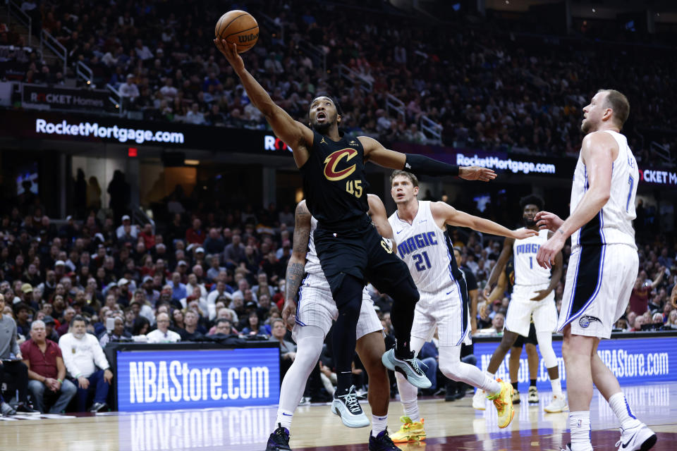 Cleveland Cavaliers guard Donovan Mitchell (45) shoots against the Orlando Magic during the first half of Game 5 of an NBA basketball first-round playoff series, Tuesday, April 30, 2024, in Cleveland. (AP Photo/Ron Schwane)