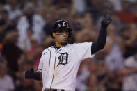 Detroit Tigers' Javier Baez scores and looks to designated hitter Miguel Cabrera after Cabrera's RBI single during the seventh inning of a baseball game against the Tampa Bay Rays, Saturday, Aug. 6, 2022, in Detroit. (AP Photo/Carlos Osorio)