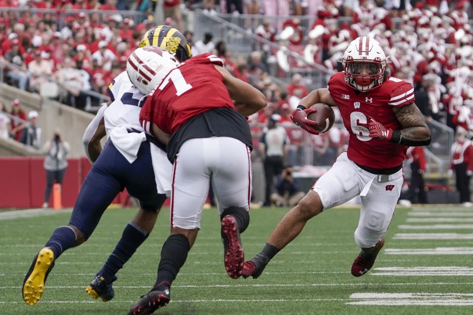 Wisconsin's Chez Mellusi runs during the first half of an NCAA college football game against Michigan Saturday, Oct. 2, 2021, in Madison, Wis. (AP Photo/Morry Gash)