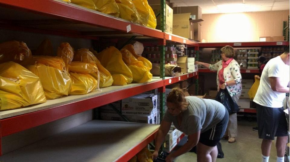 Hands On Nashville volunteers assemble care packages for Nashville CARES, a local nonprofit dedicated to ending the HIV/AIDS epidemic.