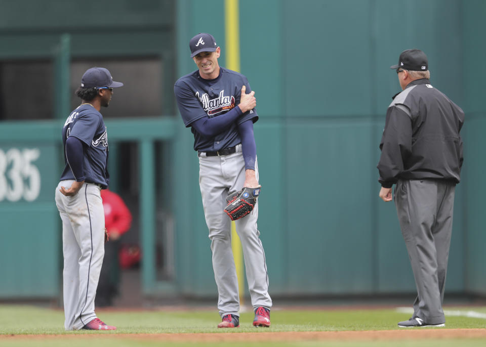 Braves starting pitcher Brandon McCarthy reacts after suffering a partially dislocated shoulder during Wednesday's game against the Nationals. (AP)