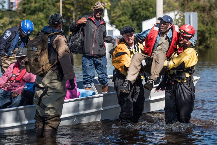 A rescue team transports residents to dry land on October 12, 2016 in Lumberton, N.C. (Photo: Sean Rayford/Getty Images)