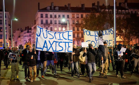 Several thousand police officers and firemen attend an unauthorised protest against anti-violence late in the night in Lyon, France, October 26, 2016. REUTERS/Robert Pratta