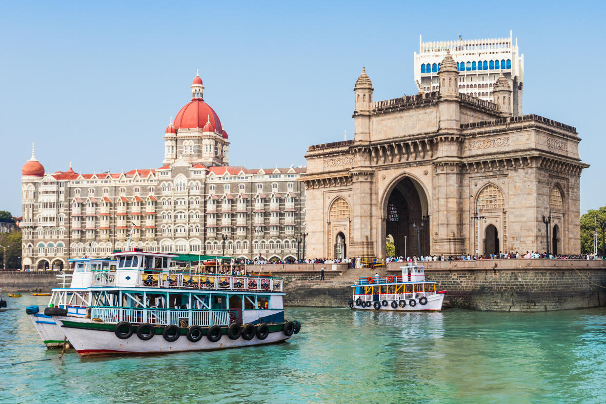 The Gateway of India and boats as seen from the Mumbai Harbour in Mumbai, India