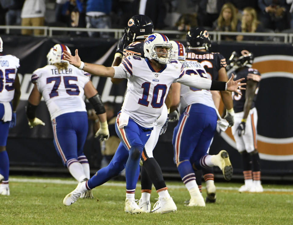 Buffalo Bills quarterback AJ McCarron (10) celebrates a game-winning touchdown throw against the Chicago Bears during the second half of an NFL preseason football game in Chicago, Thursday, Aug. 30, 2018. (AP Photo/David Banks)