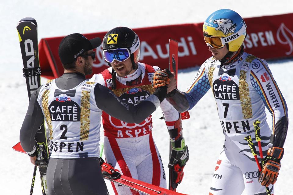 France's Mathieu Faivre, left, Austria's Marcel Hirscher, center, and Germany's Felix Neureuther celebrate after the second run of a men's World Cup giant slalom ski race Saturday, March 18, 2017, in Aspen, Colo. (AP Photo/Nathan Bilow)