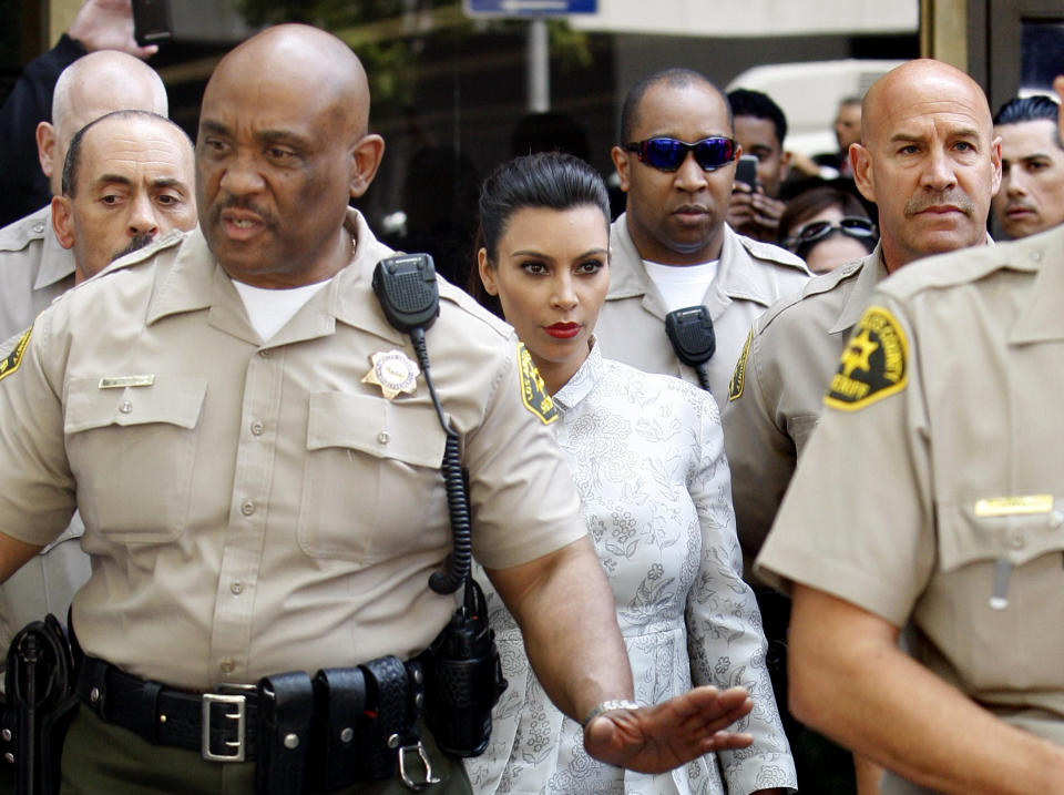 LOS ANGELES, CA - APRIL 12:  Kim Kardashian surrounded by Los Angeles County Sheriff Deputies leaves the Stanley Mosk Courthouse after attending her divorce hearing from Kris Humphries on April 12, 2013 in Los Angeles, California. Kim Kardashian and NBA player Kris Humphries are appearing for divorce proceedings. Humphries is seeking an annulment of their ten-week marriage, claiming it was based on fraud.  (Photo by David McNew/Getty Images)