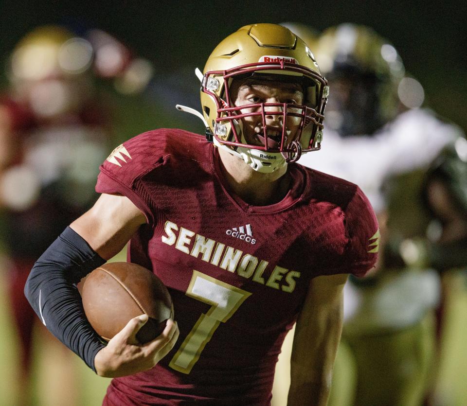 Florida High quarterback Drew Faurot (7) runs the ball in for his second touchdown of the night. The Florida High Seminoles defeat the Thomas County Central Yellow Jackets 35-15 during the first game of the football season Friday, Aug. 20, 2021.