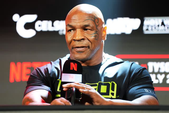 <p>Cooper Neill/Getty Images for Netflix</p> Mike Tyson speaks during a Jake Paul vs. Mike Tyson press conference in Arlington, Texas on May 16