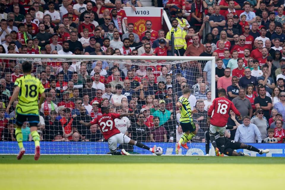 Leandro Trossard's goal gave Arsenal victory at Old Trafford - meaning they head into the final day of the season with the title still alive (AP)