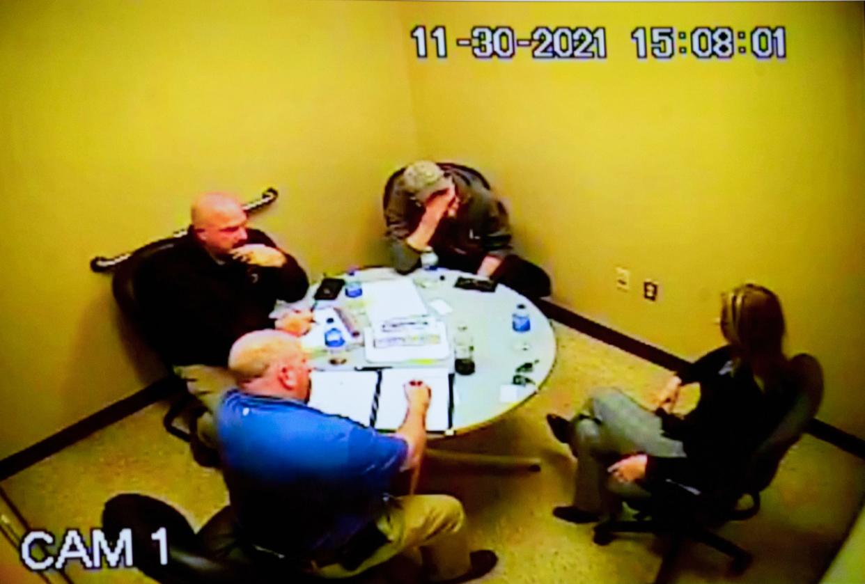 James Crumbley is seen holding his head in his hands as his wife, Jennifer, sits to his right as they are interviewed by Oakland County Sheriff deputies after their son, Ethan Crumbley, shot and killed four students at Oxford High School in on Nov. 30, 2021. The video was shown during day three in the trial of Jennifer Crumbley as she is being tried on four counts of involuntary manslaughter in the Oakland County courtroom of Judge Cheryl Matthews on Monday, Jan. 29, 2024.