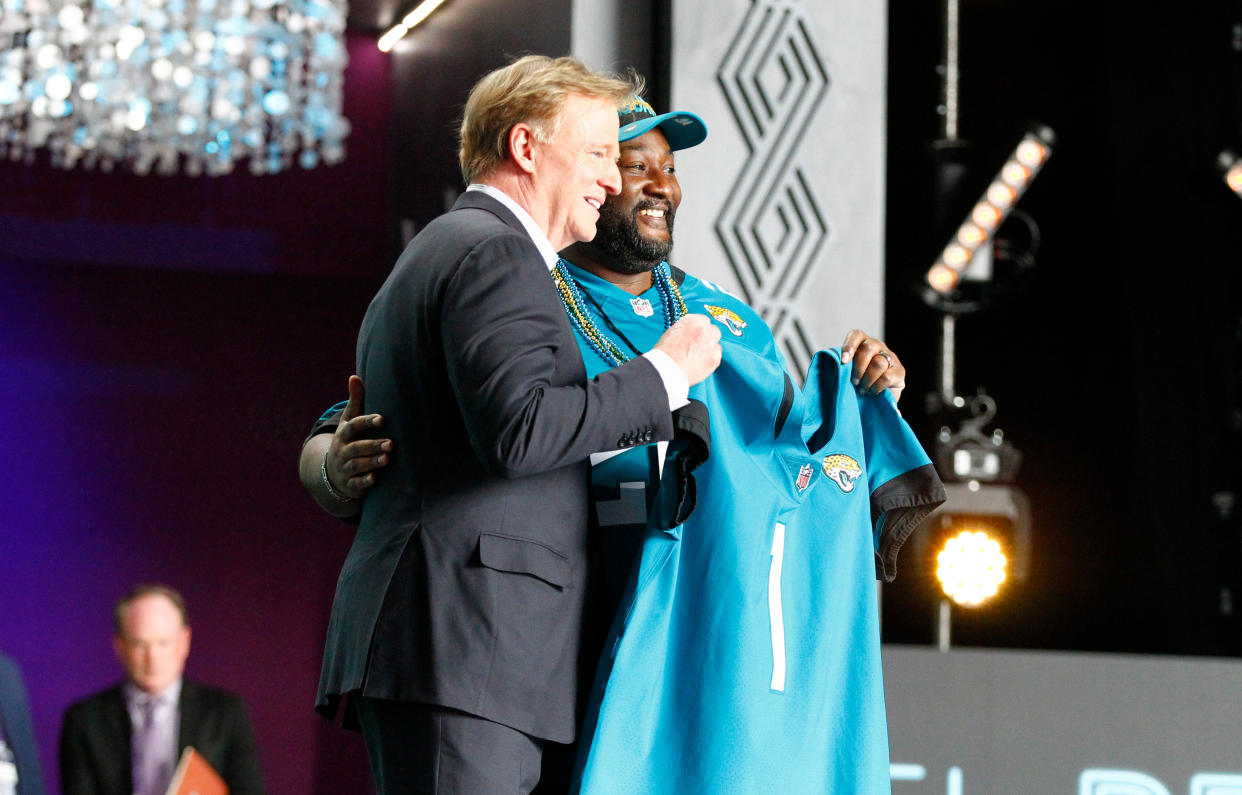 LAS VEGAS, NV - APRIL 28: NFL commissioner Roger Goodell presents the Jacksonville Jaguars number 1 jersey after their overall number one pick, Travon Walker, Georgia (not pictured) is selected during the NFL Draft on April 28, 2022 in Las Vegas, Nevada. (Photo by Jeff Speer/Icon Sportswire via Getty Images)