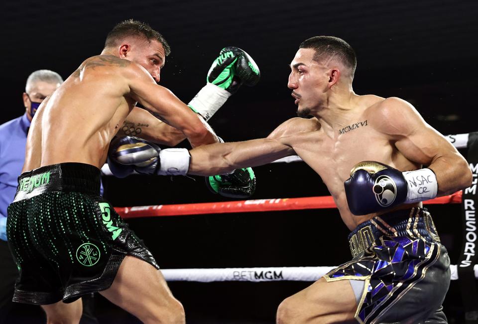 Lopez lands a body shot on Lomachenko en route to a points victoryTop Rank via Getty Images