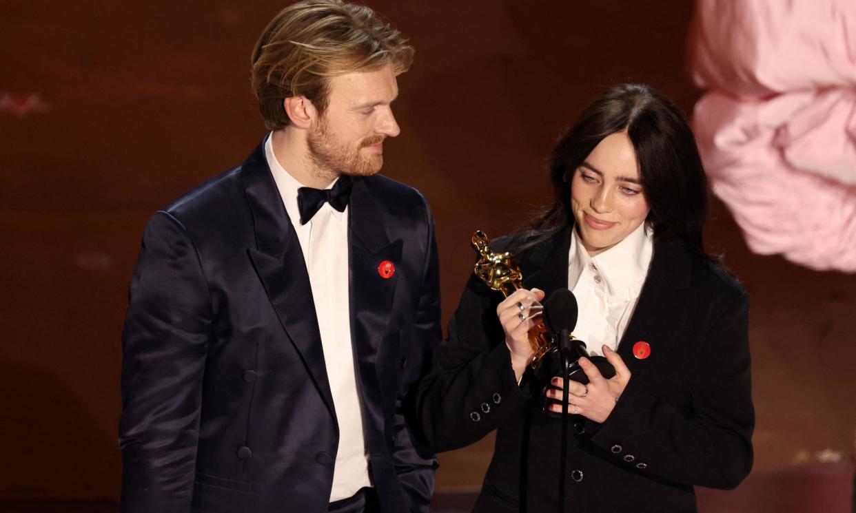 <span>Billie Eilish and Finneas O'Connell win the Oscar for best original song. </span><span>Photograph: Mike Blake/Reuters</span>