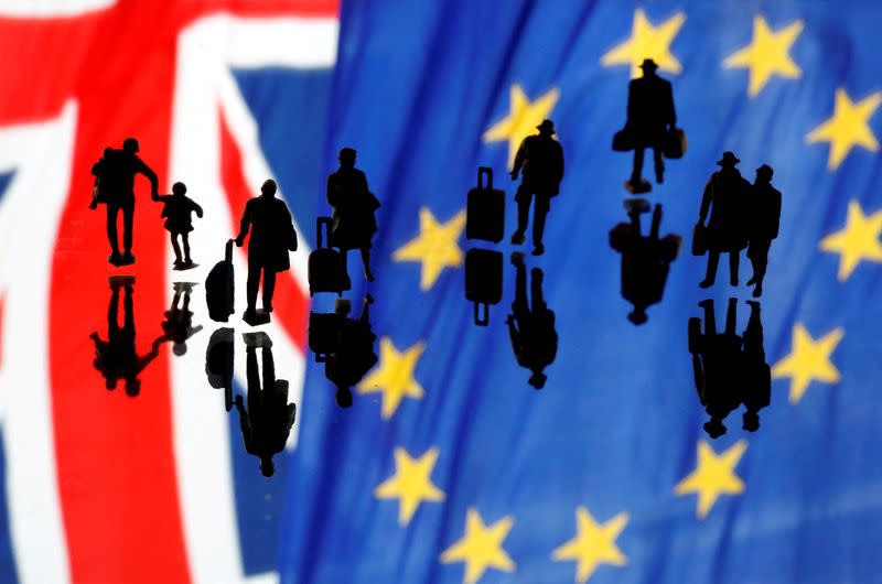 FILE PHOTO: Small toy figures are seen in front of UK and European Union displayed flags in this illustration picture,