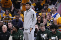 Milwaukee Bucks forward Giannis Antetokounmpo watches from the bench during the first half against the Indiana Pacers in Game 6 in an NBA basketball first-round playoff series, Thursday, May 2, 2024, in Indianapolis. (AP Photo/Michael Conroy)