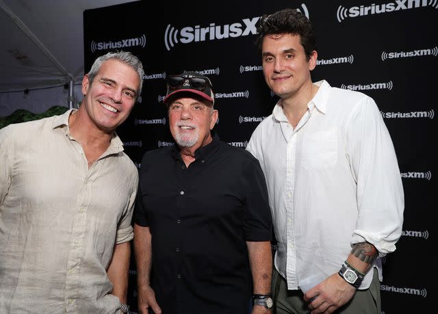 <p>Kevin Mazur/Getty</p> Andy Cohen, Billy Joel and John Mayer on Aug. 14, 2023 in the Hamptons