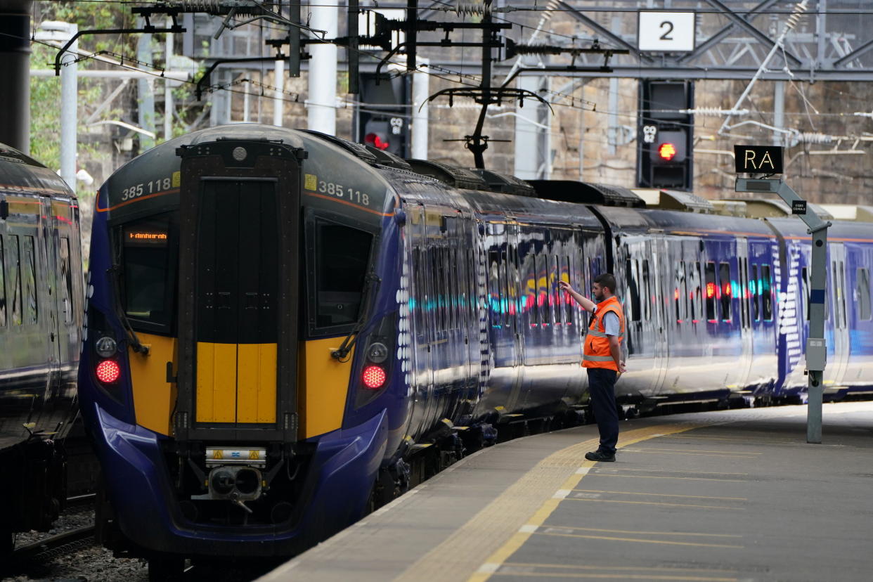 A view of Glasgow Queen Street station, in Glasgow, Scotland, Tuesday, June 21, 2022. Tens of thousands of railway workers have walked off the job in Britain, bringing the train network to a crawl in the country’s biggest transit strike in three decades. (Andrew Milligan/PA via AP)