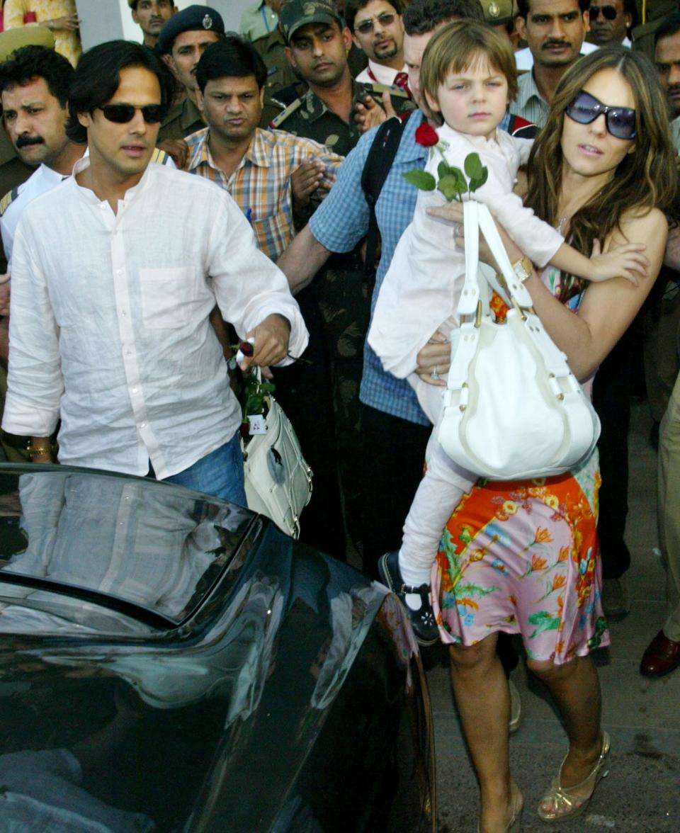 Here's Damian Hurley back in 2007 when he was 4, being held by his mom. Even then he was serving looks.