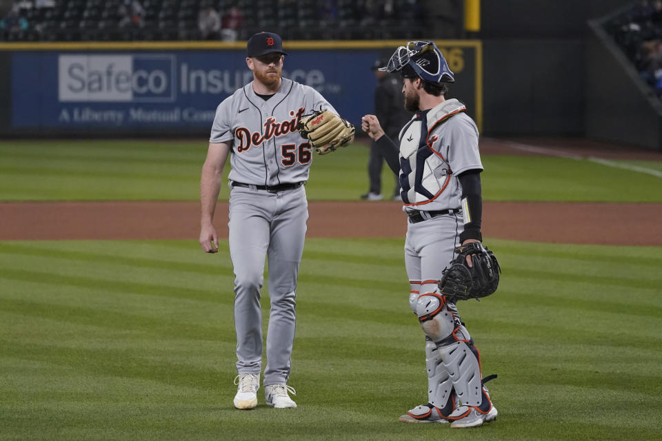 Detroit Tigers starting pitcher Spencer Turnbull, left walks with catcher Eric Haase at the end of the seventh inning of the team's baseball game against the Seattle Mariners, Tuesday, May 18, 2021, in Seattle. (AP Photo/Ted S. Warren)