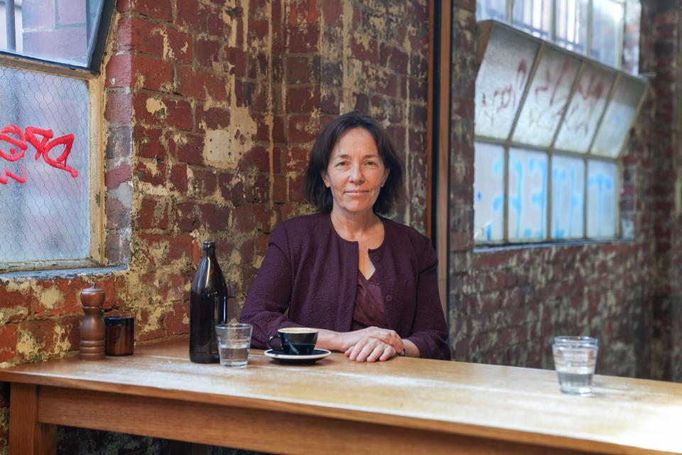 Jeannie Paterson, a professor at the University of Melbourne, meets at Seven Seeds Coffee Roasters to discuss the Victoria law against scalpers and bots.