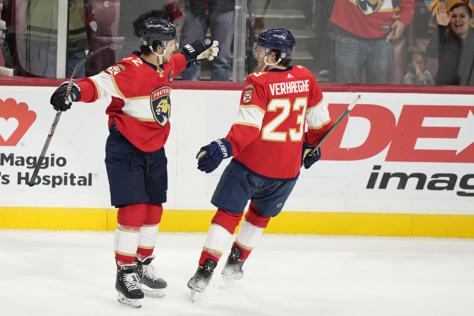 Florida Panthers defenseman Brandon Montour, left, celebrates with center Carter Verhaeghe (23) after Montour scored during the second period of an NHL hockey game against the Los Angeles Kings, Friday, Jan. 27, 2023, in Sunrise, Fla. (AP Photo/Wilfredo Lee)