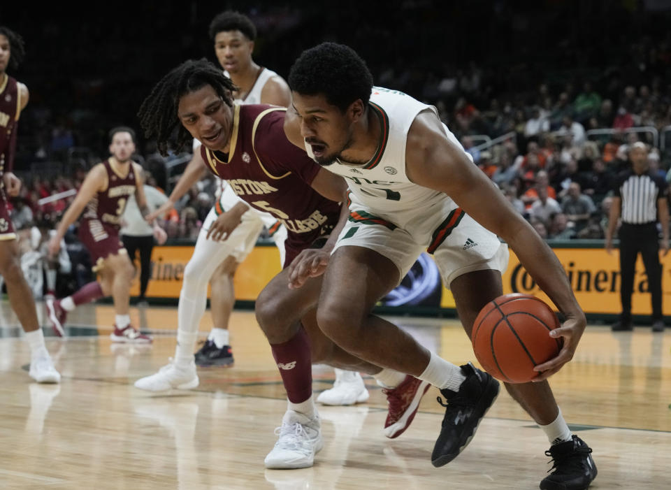 Miami guard Harlond Beverly (5) steals the ball from Boston College guard DeMarr Langford Jr. (5) during the second half of an NCAA college basketball game, Wednesday, Jan. 11, 2023, in Coral Gables, Fla. (AP Photo/Marta Lavandier)