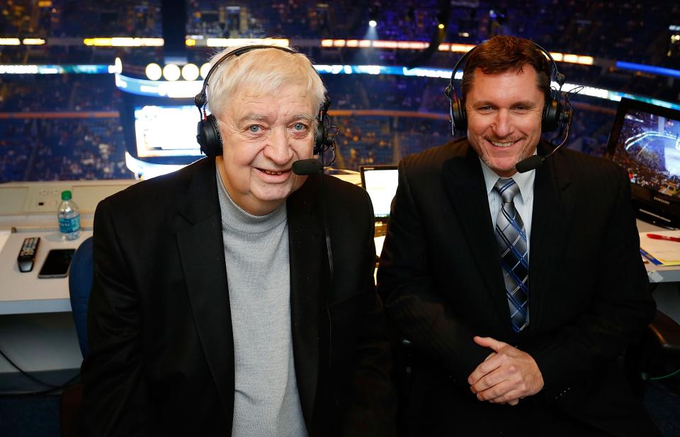 BUFFALO, NY - NOVEMBER 15: Broadcaster and cancer survivor Rick Jeanneret (L) returns alongside Dan Dunleavy (R) to broadcast a portion of the game between the Buffalo Sabres and the Toronto Maple Leafs on November 15, 2014 at the First Niagara Center in Buffalo, New York.  (Photo by Bill Wippert/NHLI via Getty Images)