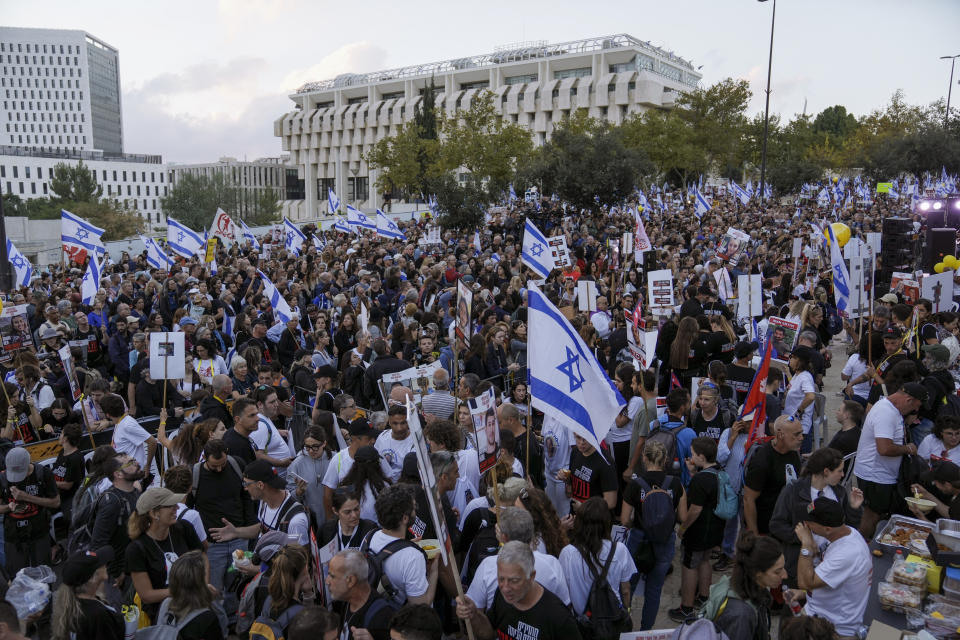 Family and supporters of the estimated 240 hostages held by Hamas in Gaza complete the final leg of a five-day solidarity rally calling for their return, from Tel Aviv to the Prime Minister's office in Jerusalem, Saturday, Nov. 18, 2023. The hostages, mostly Israeli citizens, were abducted during the brutal Oct. 7 Hamas cross-border attack in Israel and have been held in the enclave since as war rages. (AP Photo/Mahmoud Illean)