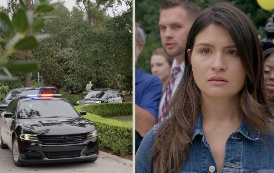 A woman watches as police cars approach her.