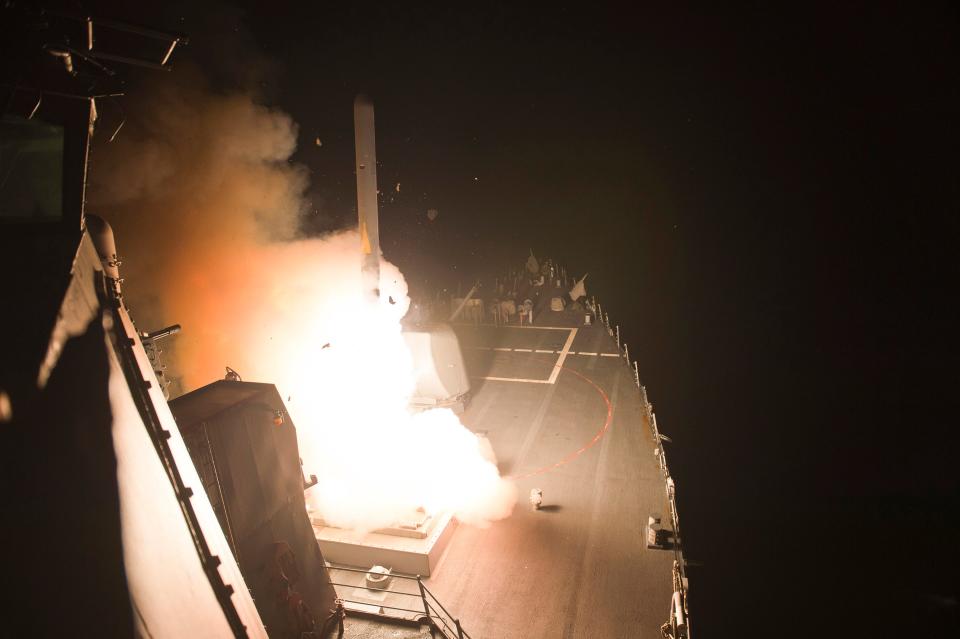 The guided-missile destroyer USS Arleigh Burke (DDG 51) launches Tomahawk cruise missiles.