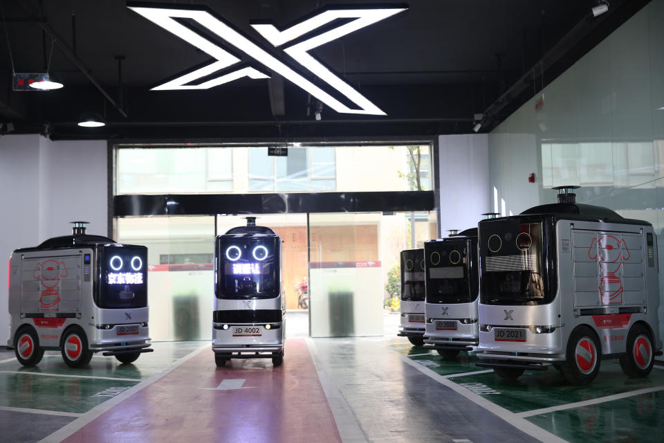 JD's delivery vehicles in a parking garage.