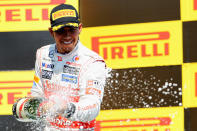 MONTREAL, CANADA - JUNE 10: Lewis Hamilton of Great Britain and McLaren celebrates on the podium after winning the Canadian Formula One Grand Prix at the Circuit Gilles Villeneuve on June 10, 2012 in Montreal, Canada. (Photo by Mark Thompson/Getty Images)