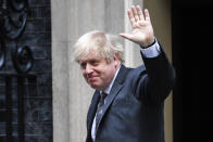 Britain's Prime Minister Boris Johnson returns to 10 Downing Street as started the debate in Parliament, on his trade deal with the European Union (EU), in London, Wednesday, Dec. 30, 2020. The European Union’s top officials have formally signed the post-Brexit trade deal with the United Kingdom, as lawmakers in London get set to vote on the agreement. (AP Photo/Alberto Pezzali)