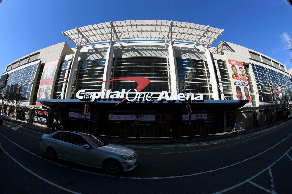 FILE - An exterior view of Capital One Arena is seen Saturday, March 16, 2019, in Washington. Capital One Arena is home to the Washington Capitals NHL hockey team and Washington Wizards NBA basketball team. A person with knowledge of the sale tells The Associated Press the Qatar Investment Authority is buying a 5% stake of the parent company of the NBA's Washington Wizards and NHL's Washington Capitals for $4.05 billion. It is believed to be the first time the government of Qatar is investing in North American professional sports.  (AP Photo/Nick Wass) ORG XMIT: NY158