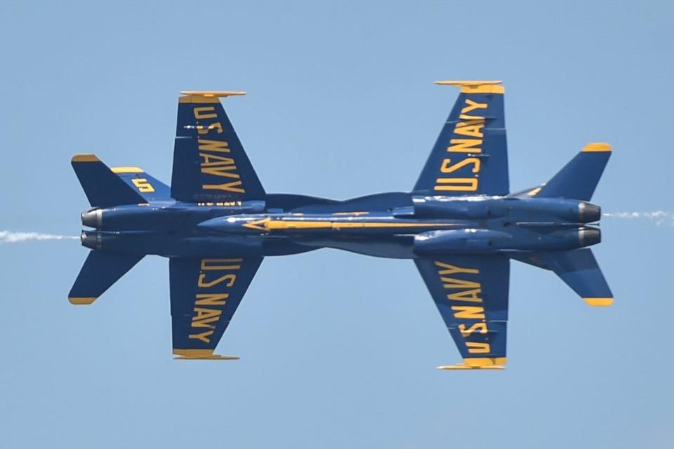 F/A-18 Aircraft, July 2018. Solo pilots assigned to the U.S. Navy flight demonstration squadron, the Blue Angels, perform the Opposing Knife Edge maneuver during the National Cherry Festival in Traverse City, Michigan, July 1, 2018. The Blue Angels are scheduled to perform more than 60 demonstrations at more than 30 locations across the U.S. and Canada in 2018.