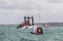 <p>In this photo provided by America’s Cup Event Authority, Emirates Team New Zealand capsizes during an America’s Cup challenger semifinal against Great Britain’s Land Rover BAR on the Great Sound in Bermuda on Tuesday, June 6, 2017. (Ricardo Pinto/ACEA via AP) </p>