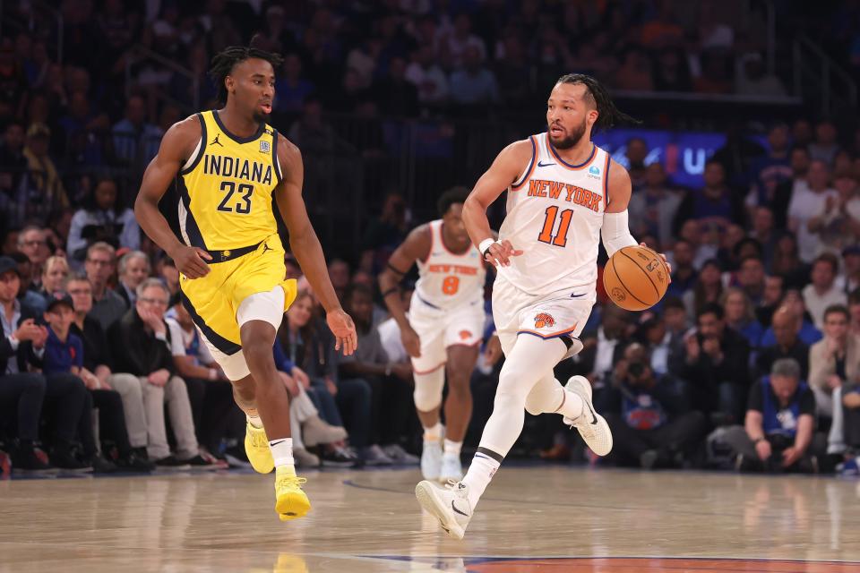 May 6, 2024; New York, New York, USA; New York Knicks guard Jalen Brunson (11) brings the ball up court against Indiana Pacers forward Aaron Nesmith (23) during the first quarter of game one of the second round of the 2024 NBA playoffs at Madison Square Garden. Mandatory Credit: Brad Penner-USA TODAY Sports