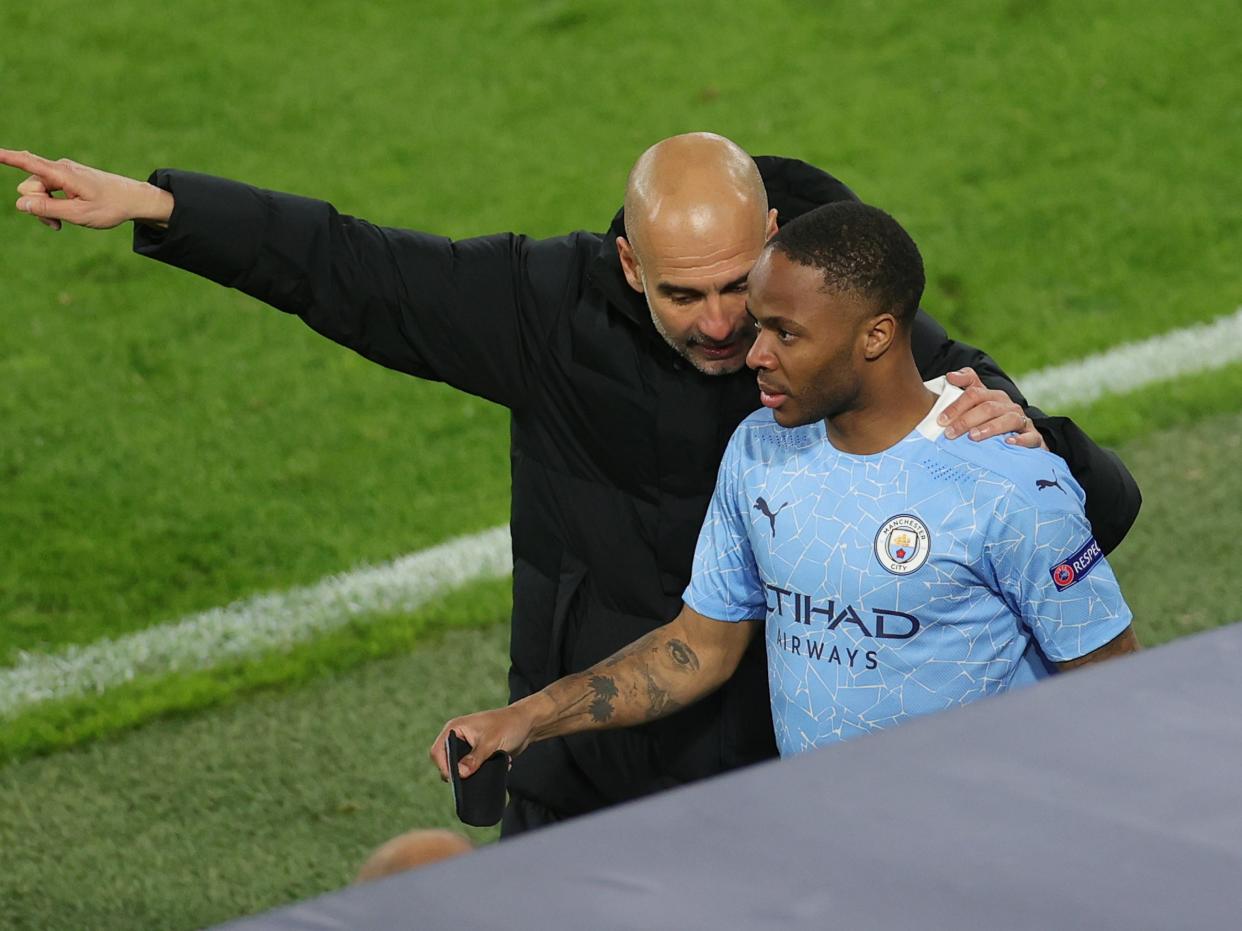 Manchester City winger Raheem Sterling with Pep Guardiola (Friedemann Vogel - Pool/Getty Images)